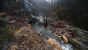 View of the river flowing from the mountain mini waterfalls. Forest river in the mountains. Mountain forest river view. Beautiful Landscape. Fall. Autumn mood.