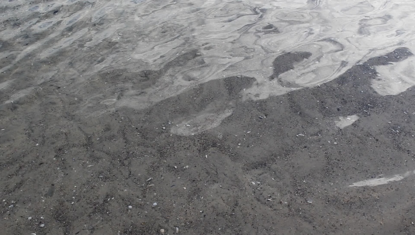 Wavy water surface with sky relfection 