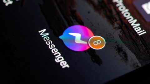 Budapest, Hungary - Circa 2022: Notifications about many unread messages on Facebook Messenger on a smartphone, groing number as getting more texts