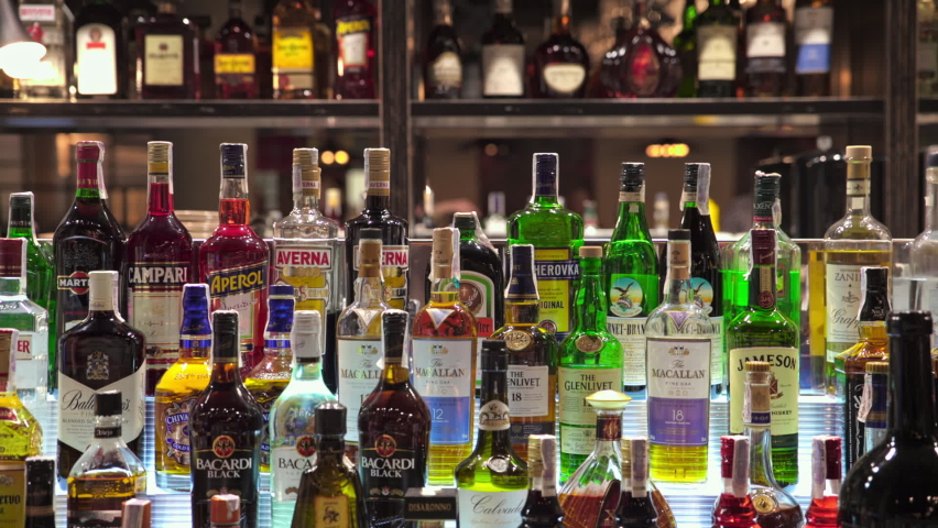Bar in restaurant. alcoholic drinks. many different drinks in bottles. collection of alcohol. different spirits sorts, bottles rows, mirror background. close-up. dolly shot
May 11, 2021, Kyiv, Ukraine