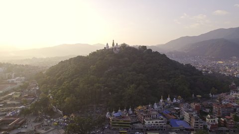 Flying over Kathmandu towards Swayambhunath Stupa to get a closer view of the hill and trees.