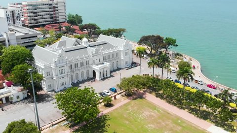 Upwards Revealing Drone Shot Over Penang Town Hall, Showing The Sea And Penang Coastline in The Background. George Town, Penang in Malaysia