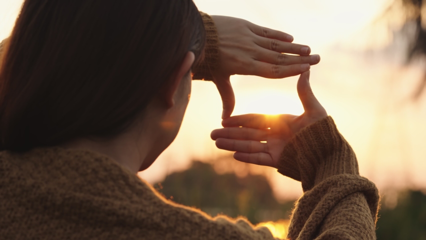 B roll - New year planning and vision concept, Close up of woman hands making frame gesture with sunset, Female capturing the sunrise. Royalty-Free Stock Footage #1085175251