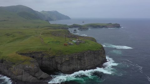 Flying Above the Shpanberg Lighthouse on Shikotan Island. Lesser Kuril Chain, Coastline of Pacific Ocean, Russia.