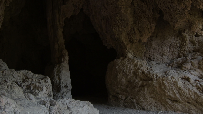 Entrance to a cave, tilt Royalty-Free Stock Footage #1085181536