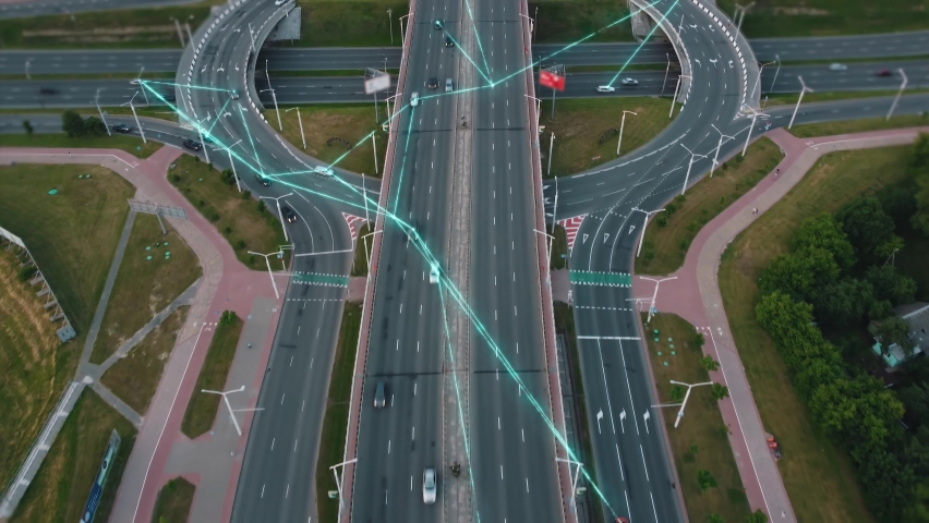 Autonomous self-driving cars are moving along the city junction. The vehicles are connected to a common network of future and exchange data. Artificial intelligence in automotive control concept. Royalty-Free Stock Footage #1085184170