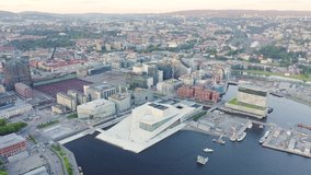 Inscription on video. Oslo, Norway. View overlooking the town. Sunset. Aerial view. Shimmers in colors purple, Aerial View, Point of interest