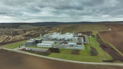 DAMBORICE, CZECH REPUBLIC, NOVEMBER 15, 2021: Oil gas natural plant factory drone aerial view processing storages tanks fossil pipes refinery pumpjack fracking extraction pump jack machine field