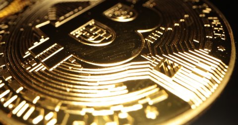  Macro shot of Bitcoin coins. 4K video of BTC. Golden Bitcoin, crypto currency. Digital exchange, popularity of BTC, symbol of future money