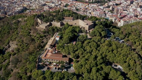 Aerial 4K video from drone to of Malaga Gibralfaro castle in the background a panoramic view of the city of Malaga. Malaga.Spain,Costa del sol, Andalusia (Series)