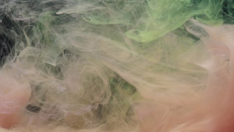 Pink and yellow ink acrylic paint mixing in water, swirling softly underwater. Colored acrylic cloud of paint in aquarium. Slow motion abstract smoke explosion animation. Beautiful art background