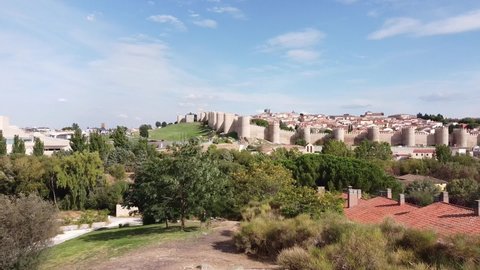 flight with drone over the walled city of Avila