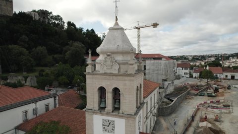Belfry bell tower drone close up in portuguese church at Leiria, orbital shot