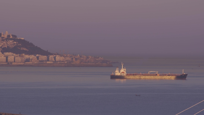 view of algiers harbor in sunrise during foggy winter season