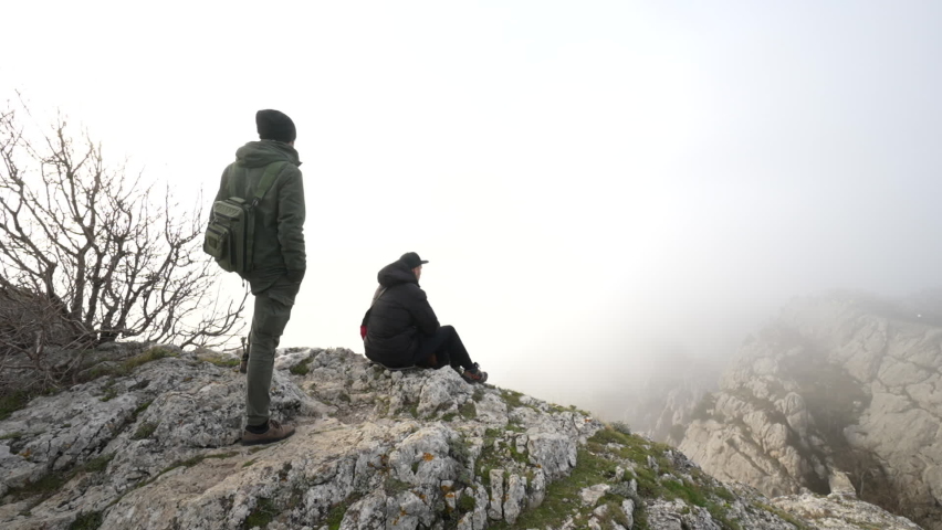 Two people on mountain have rest