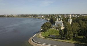 4K aerial drone video of beautiful cathedral on sunny day in Volga River waterfront of Uglich - a small medieval picturesque town in Yaroslavl Region, Russia