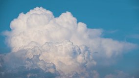 Timelapse of white puffy cumulus clouds forming on summer blue sky. Moving and changing cloudscape weather - Powered by Shutterstock - Get 15% off with code: PIKWIZARD15