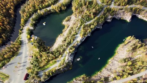 Beautiful nature of Karelia republic. Mountain park Ruskeala. Aerial view from drone to the lake and boat. Aqua colour of water. Russian geographic. Marble quarry canyon.Sight and karelian showplace. 