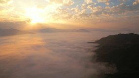 4K Aerial video, The sun's rays over the sea of mist in the morning
