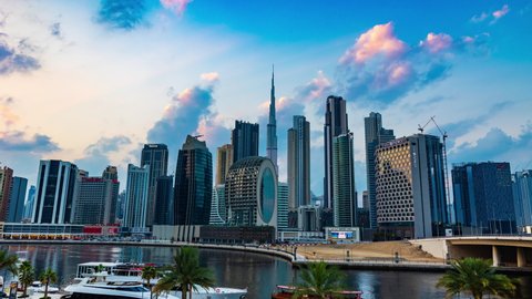 Dubai, UAE - January 4 2022: Time lapse video of Dubai city skyscrapers or skyline along with Burj khalifa with moving clouds. 4K Dubai Day to Night Transition or Timelapse Video