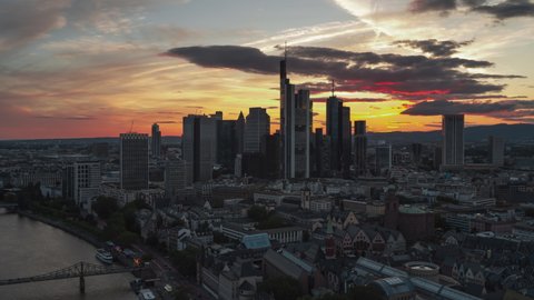 Frankfurt, Germany - circa 2021 - Establishing Aerial View Shot of Frankfurt am Main De, financial capital of Europe, Hesse, Germany, dramatic sunset