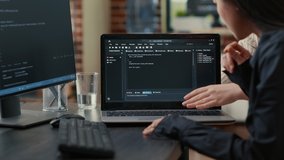 Team of programmers talking about algorithm running on laptop screen pointing at source code while sitting at desk. Software developers collaborating on data coding group project. - Powered by Shutterstock - Get 15% off with code: PIKWIZARD15