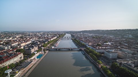 Establishing Aerial View Shot of Lyon Fr,  Auvergne-Rhone-Alpes, France, day push in, river Rhone