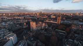 Establishing Aerial View Shot of London UK, United Kingdom, late sunset, city center, Big Ben, Westminster Parliament, Westminster Abbey, city skyline, push in