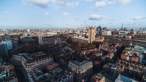 Establishing Aerial View Shot of London UK, United Kingdom, day, city center, Big Ben, Westminster Parliament, Westminster Abbey, city skyline, Parliament Square Garden, low push in slow