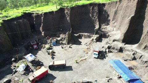 Yogyakarta Indonesia January 12, 2022 : Aerial video activity Sand Mining Trucks on Mount Merapi, Yogyakarta