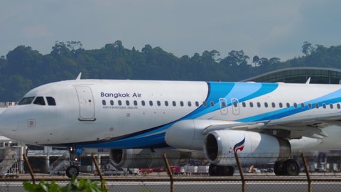 PHUKET, THAILAND - DECEMBER 02, 2018: Bangkok Airways Airbus 320 HS-PPO taxis from terminal to runway at Phuket international airport (HKT). Tourism and travel concept. Departing flight on a sunny hot