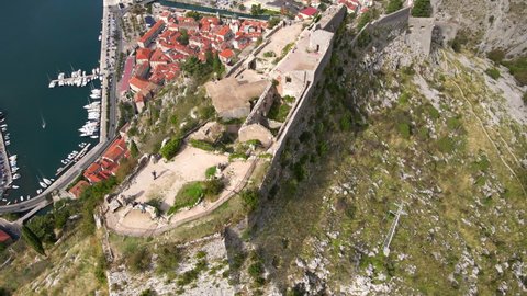 Aerial shot of the fortress St John San Giovanni over the Old Town of Kotor, the famous tourist spot in Montenegro.
