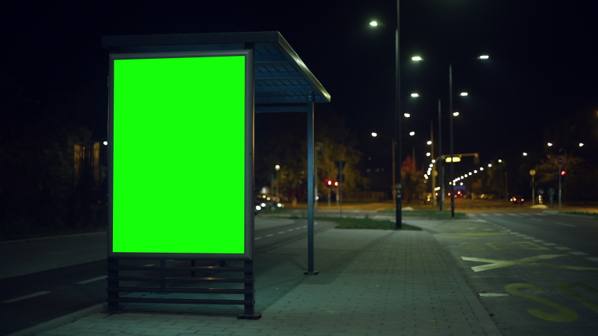 Bus stop advertising poster mock up at night, green screen copy space for commercial message Royalty-Free Stock Footage #1085242508