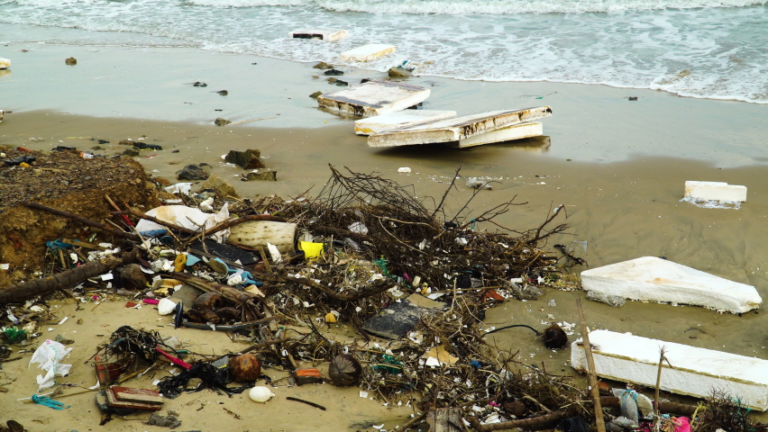 Giant pieces of styrofoam are washed ashore, plastic parts are lying on the beach, an immensely polluted place