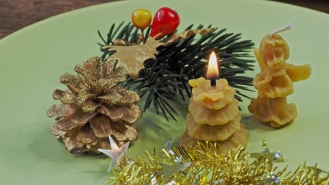 Beeswax candles. Happy Christmas. Congratulatory Christmas background.