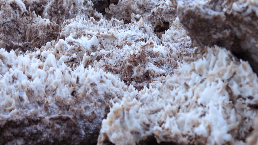 Salt valley with dirty cracked and swollen crystalline salt, dead salt landscape in Death Valley National Park, California