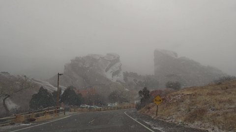 Denver, Colorado, USA - CIRCA 2022: Red Rock Park Amphitheater Canyon Snow Storm Blizzard Covered The Road with Ice during Winter Frozen