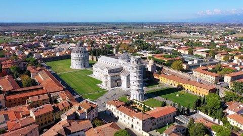 Pisa, Italy - October 23, 2021: Pisa Cathedral and the Leaning Tower in a sunny day in Pisa, Italy. Cathedral with Leaning Tower of Pisa on Piazza dei Miracoli, Tuscany, Italy.