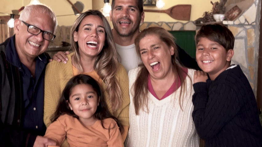 Happy latin family smiling on camera while hugging together - Concept of family love  Royalty-Free Stock Footage #1085264441