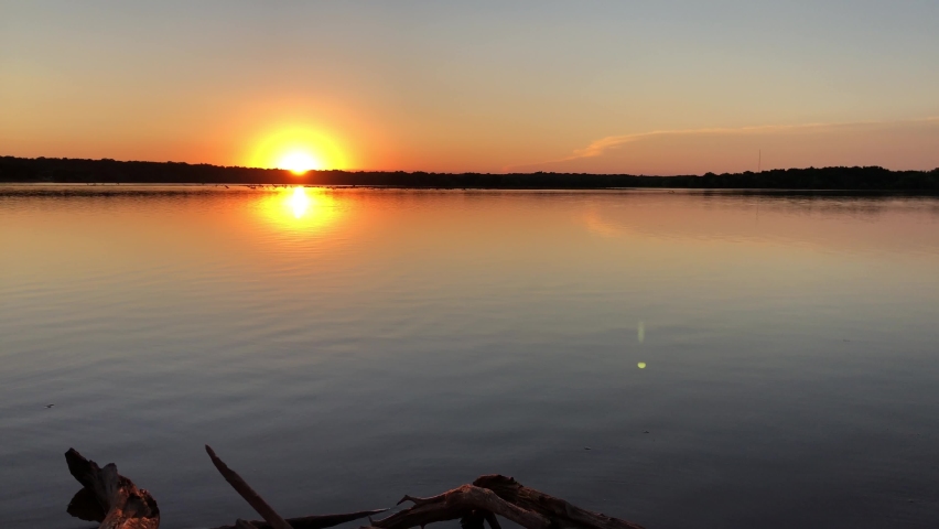 Beautiful sunset over the lake reflected in the waters