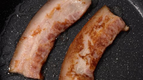 Bacon in a Frying Pan. Close-up.