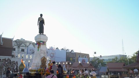 Nakhon Ratchasima, Thailand - November 19, 2021: In the morning, people pay their respects in front of the Thao Suranari Monument.