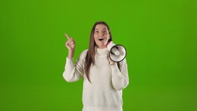 Pleasant young woman in white knitted using megaphone while gesturing and talking over green background. Promotion, discount and attention concept. - Powered by Shutterstock - Get 15% off with code: PIKWIZARD15