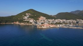Aerial video. Slowmotion shot. The Old Town of the city of Budva popular tourist destination in Montenegro