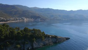 Slowmotion aerial video. The city of Budva, view on the Bechichi or Becici beach, a popular tourist place in Montenegro