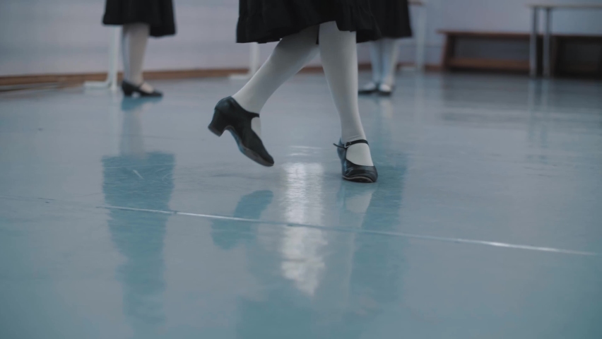 Beautiful Young Ballerinas Doing Stretching Near Barre. 