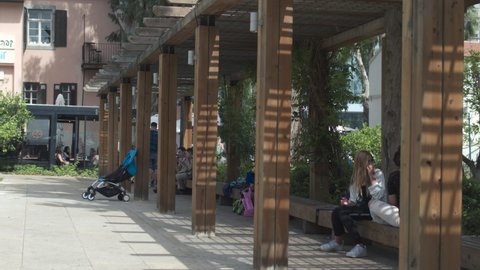 01.05.2020,Tel Aviv,Israel. People rest in the Sarona quarter in the center of Tel Aviv