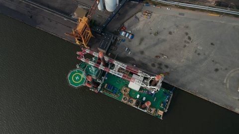 Aerial view of Liebherr Seafox 5 offshore crane moored in front of Esbjerg's Power Station in Denmark. With a maximum lifting capacity of 1,200t is the biggest crane of the board offshore crane series