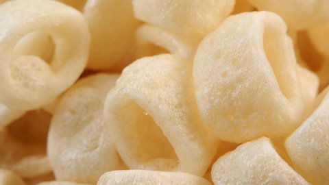 Hula hoops crisps snack extreme close up rotating very slowly stock footage