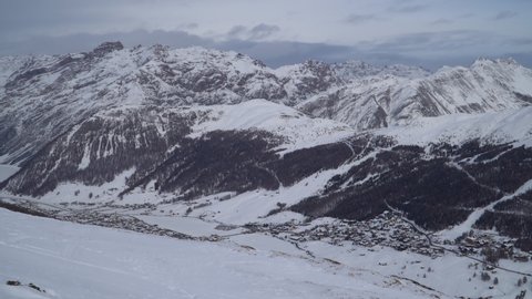 Panoramic view of the Italian Alps in winter seen from the slopes of the ski resort of Livigno